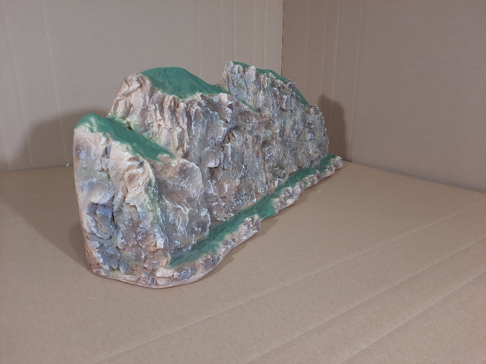 The 885 Sheer Rock Wall is very detailed with sharp rock crevises along with a steep rock wall.